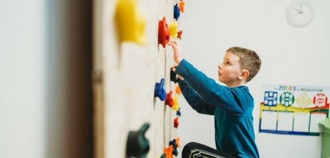 boy-climbing-wall-Boston-Sensory-Solutions